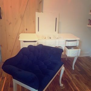 White vanity and blue chair